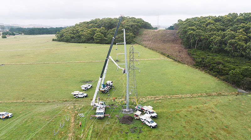 Crews putting the new transmission tower up