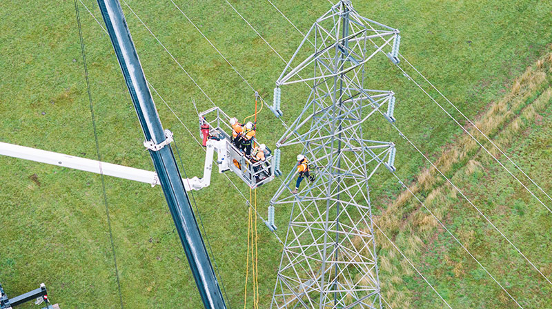 Crews taking down the old transmission tower